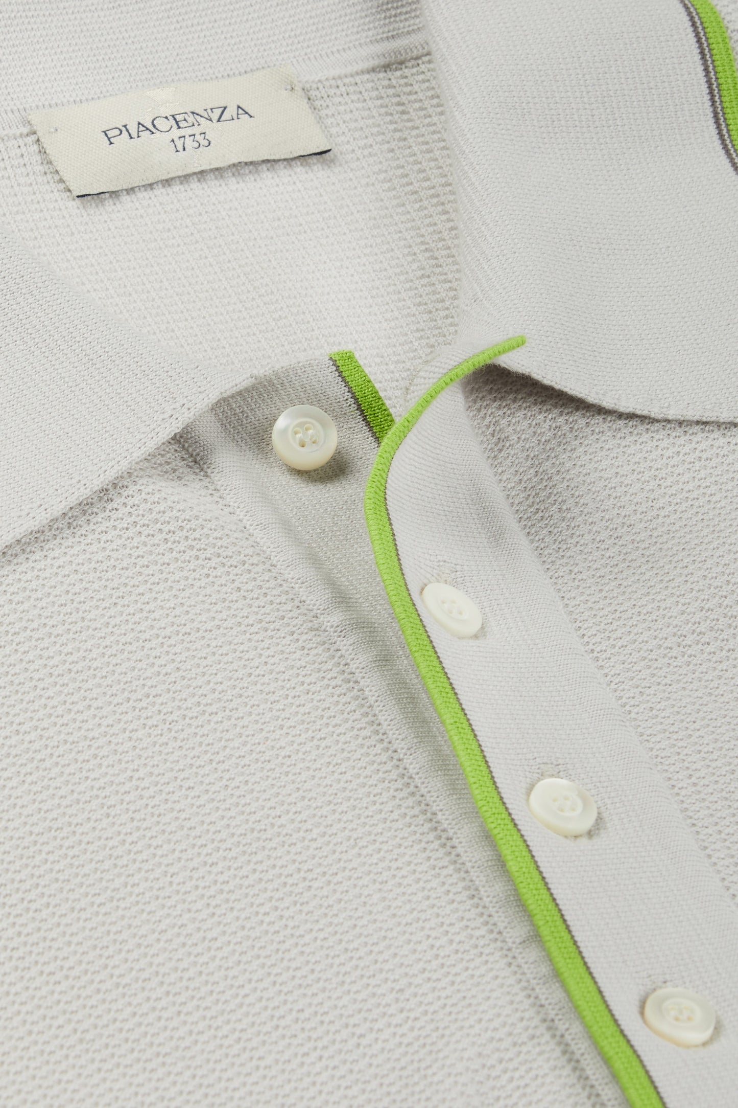 Polo shell stitch con bordo verde fluo