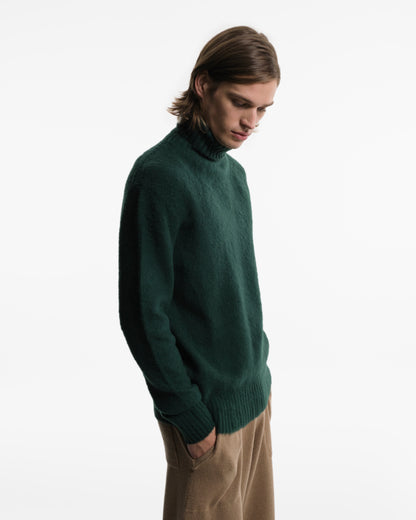 Soft turtleneck in green wool