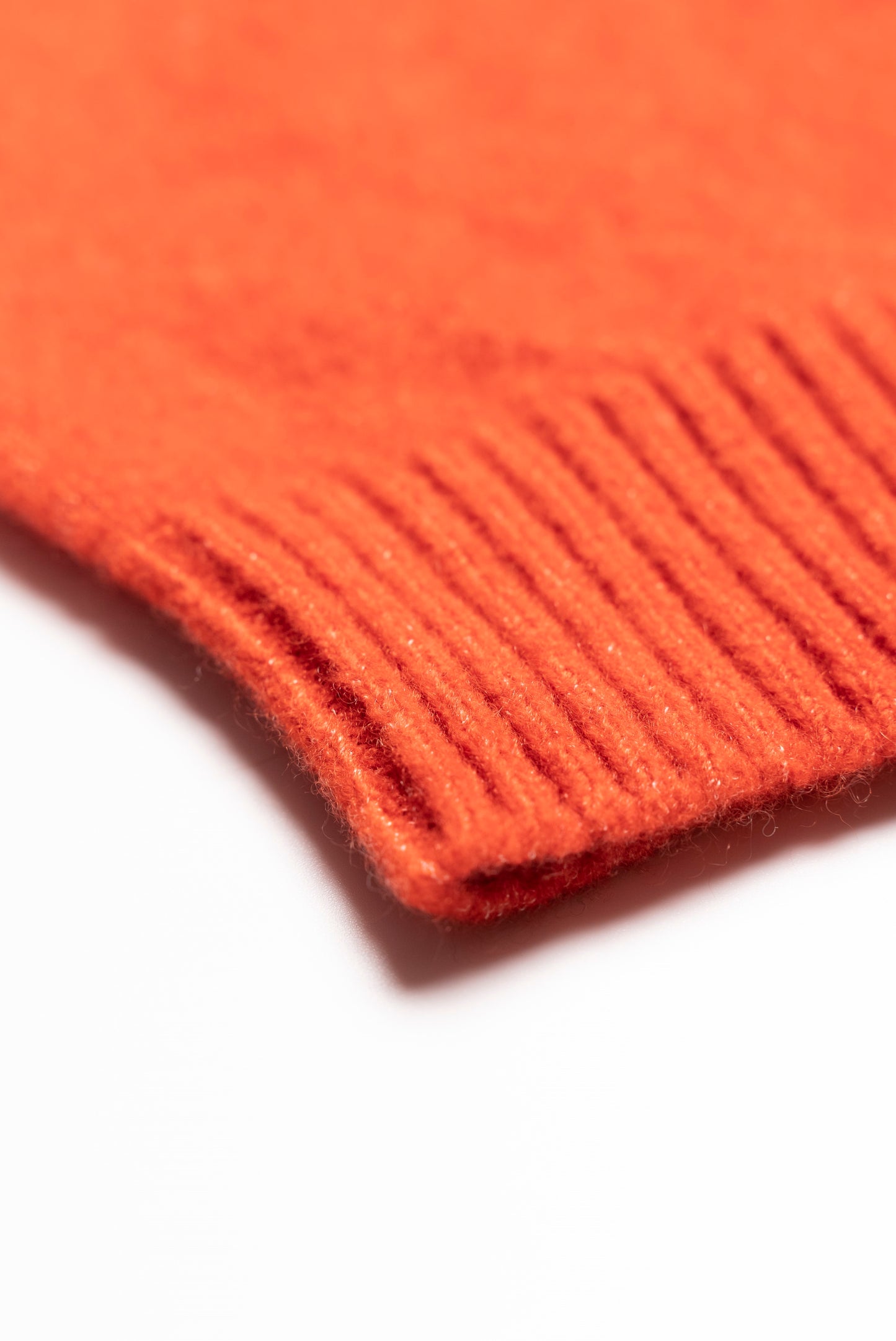 Orange shaved cap with ribbed bottom